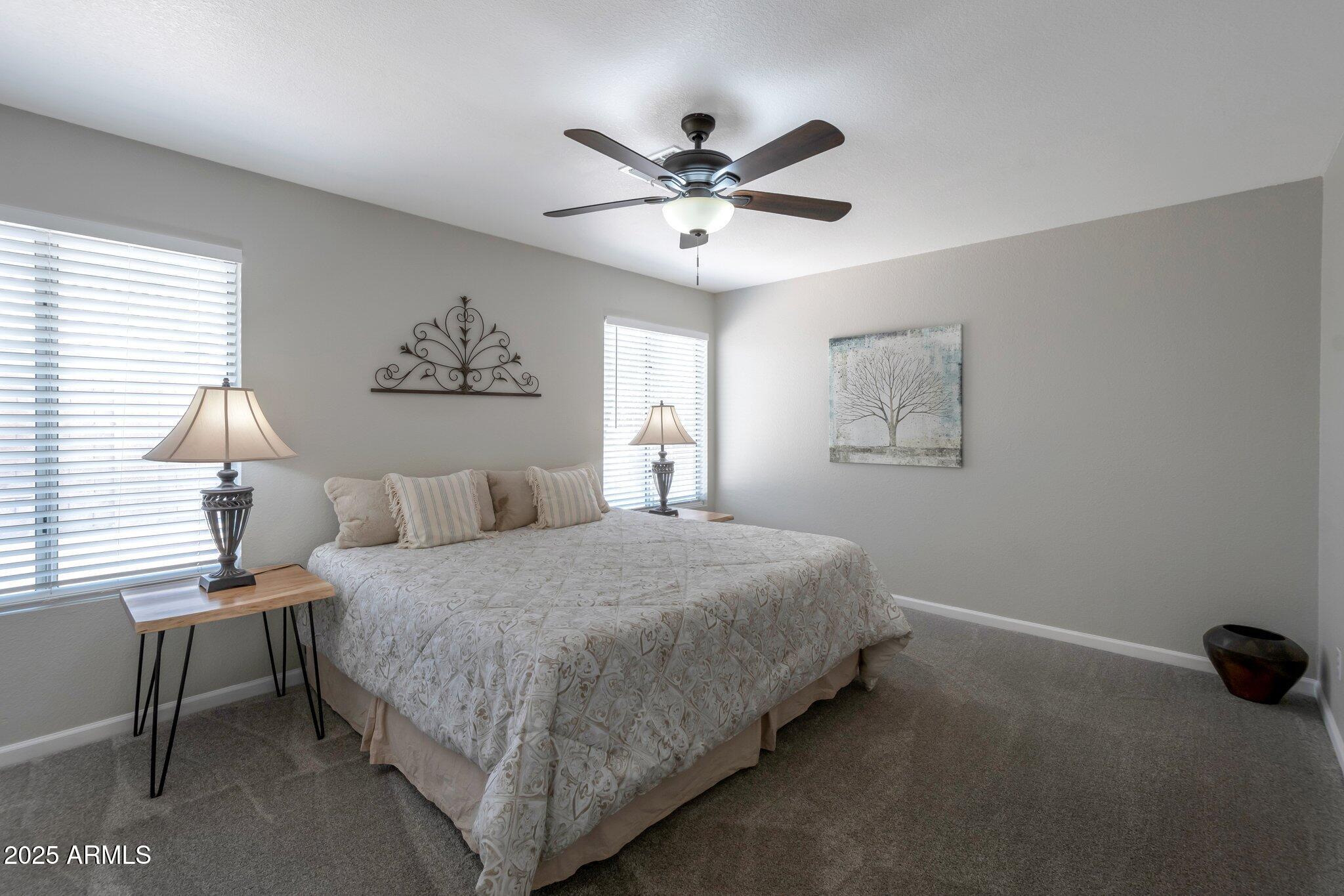 839 West Silver Creek Road Gilbert, AZ 85233 - Photo 7 of 15 a bedroom with a bed and a window
