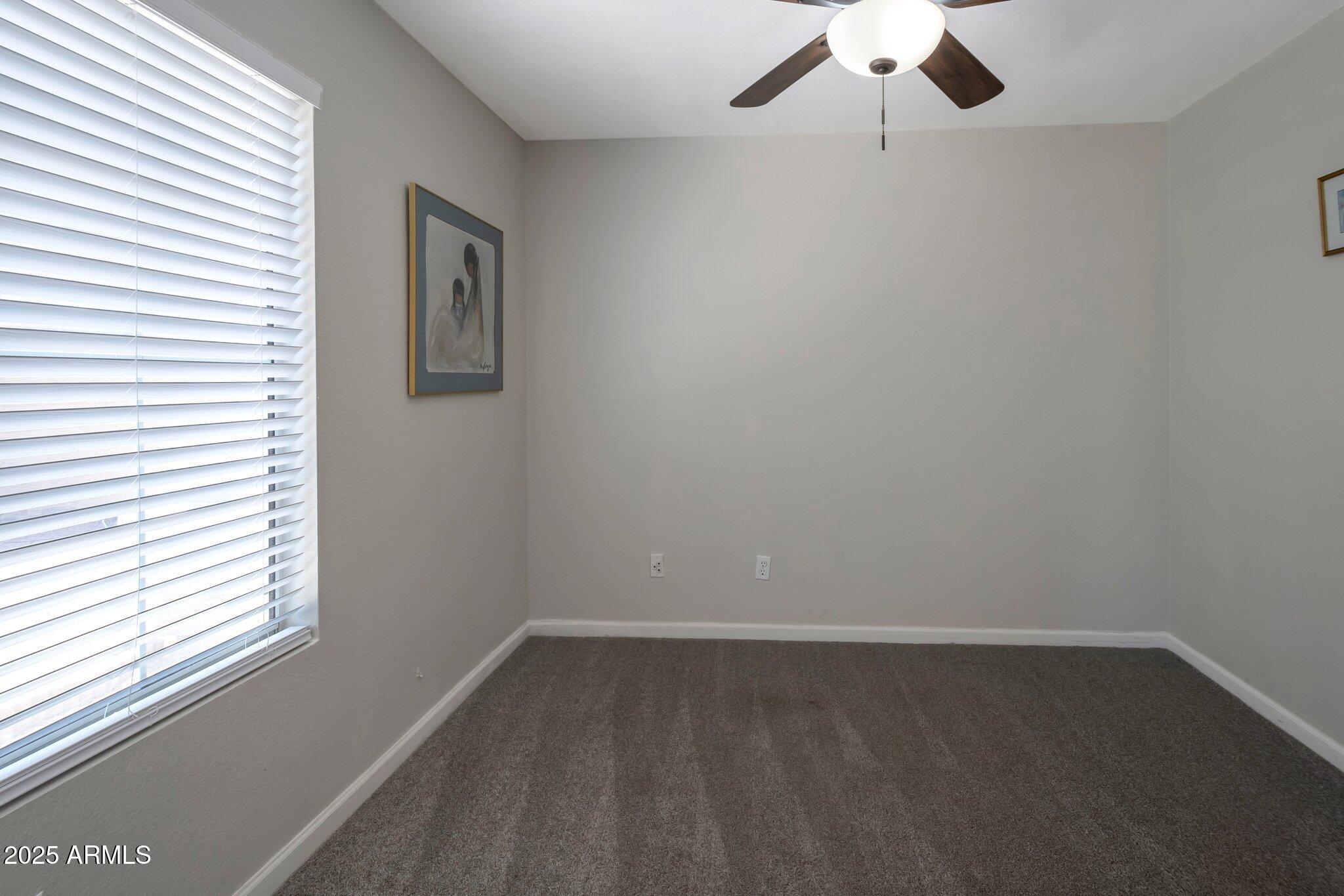 839 West Silver Creek Road Gilbert, AZ 85233 - Photo 10 of 15 an empty room with a window