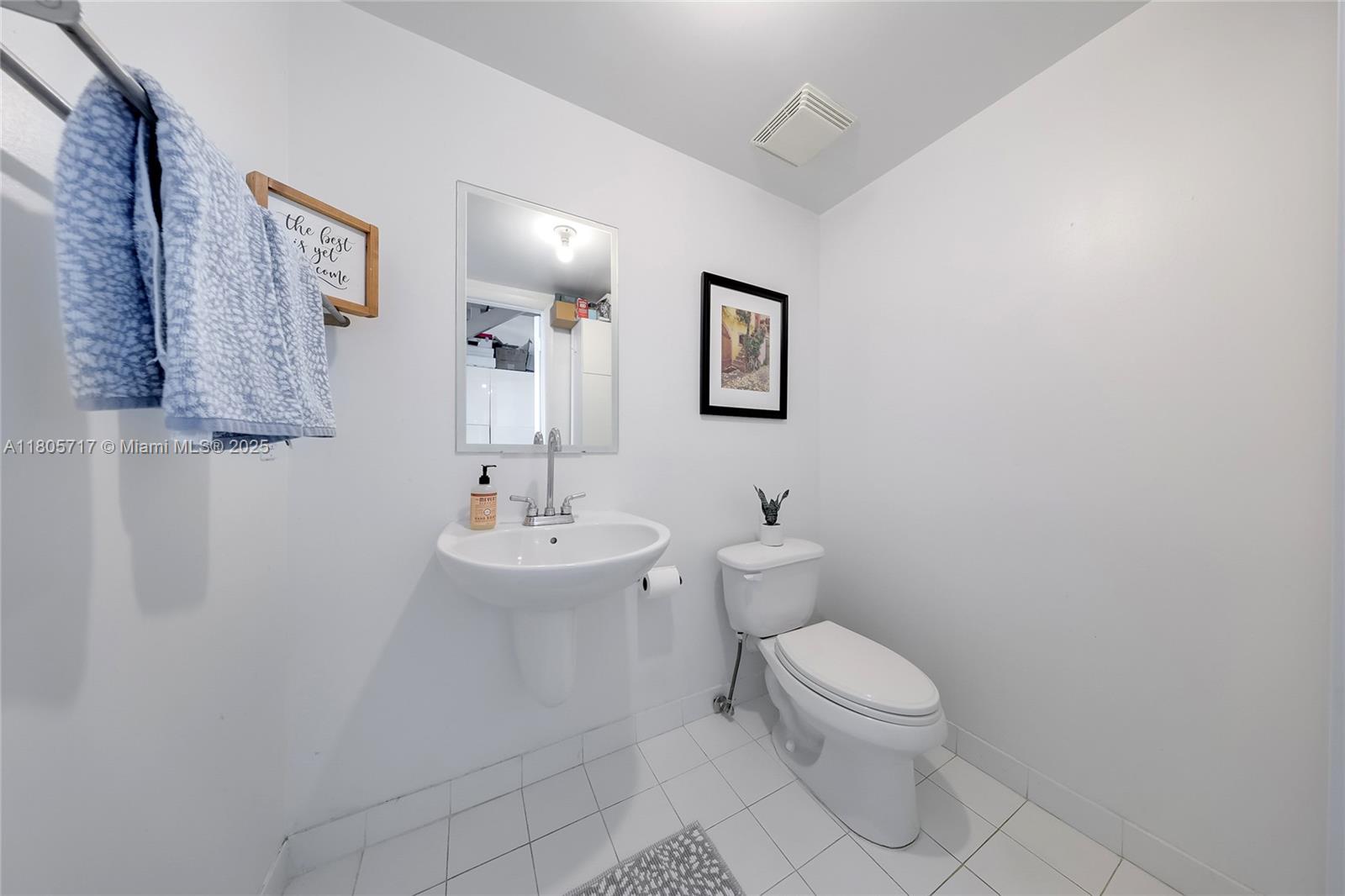 690 Southwest 1st Court, Unit 2109 Miami, FL 33130 - Photo 13 of 13 a bathroom with a toilet sink and mirror
