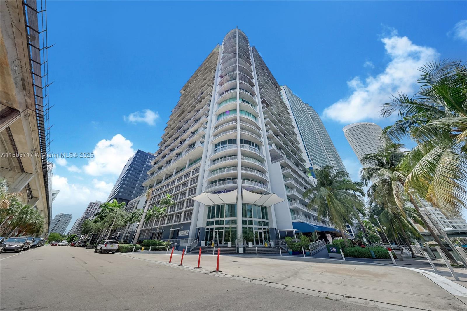 690 Southwest 1st Court, Unit 2109 Miami, FL 33130 - Photo 2 of 13 a view of a tall building next to a road