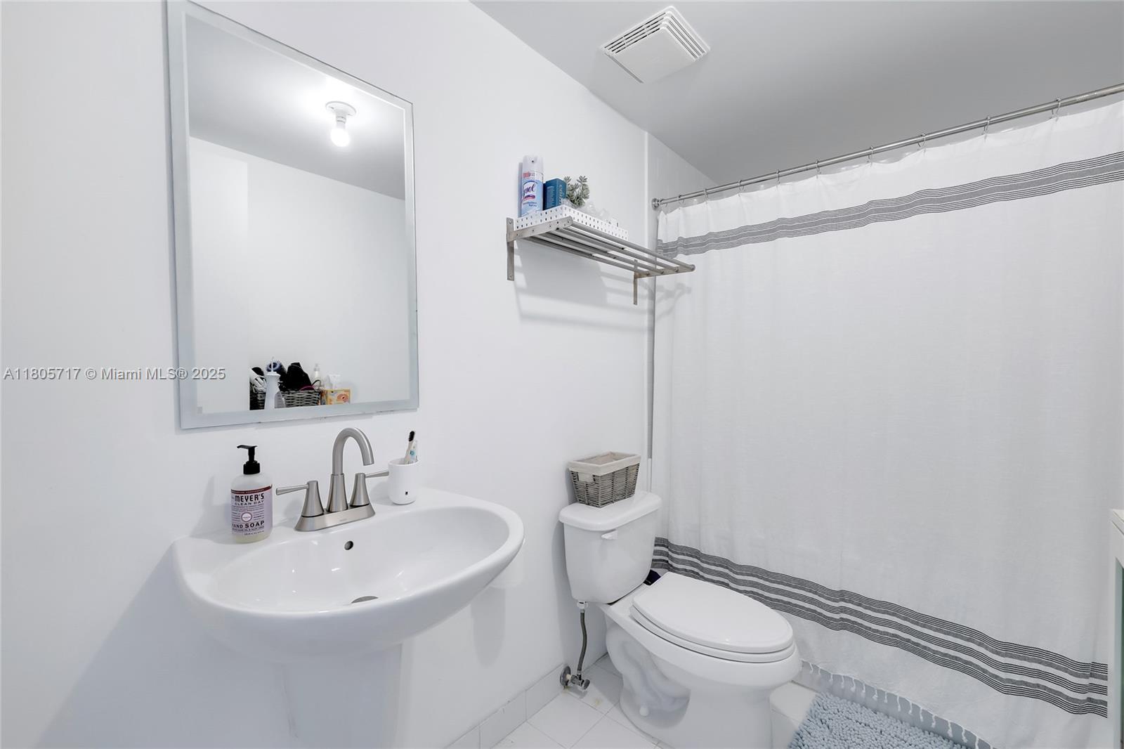 690 Southwest 1st Court, Unit 2109 Miami, FL 33130 - Photo 7 of 13 a white toilet sitting next to a bathroom sink