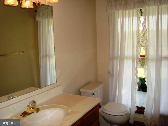 20535 Bucklodge Road Boyds, MD 20841 - Photo 14 of 30 a bathroom with a sink and toilet