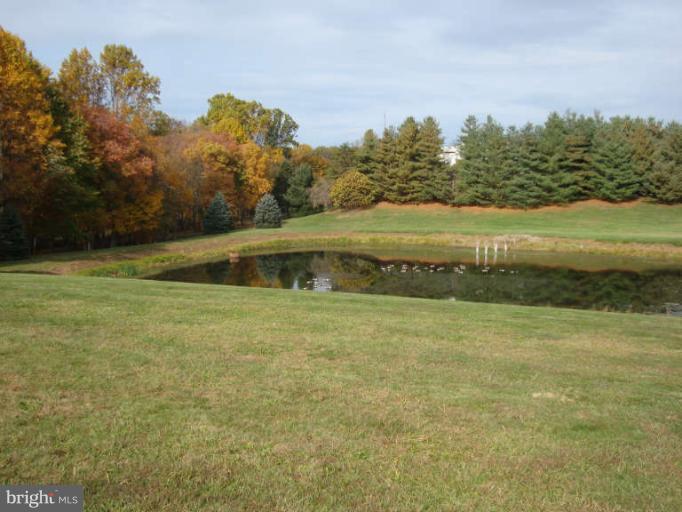 20535 Bucklodge Road Boyds, MD 20841 - Photo 26 of 30 a view of a lake with a big yard