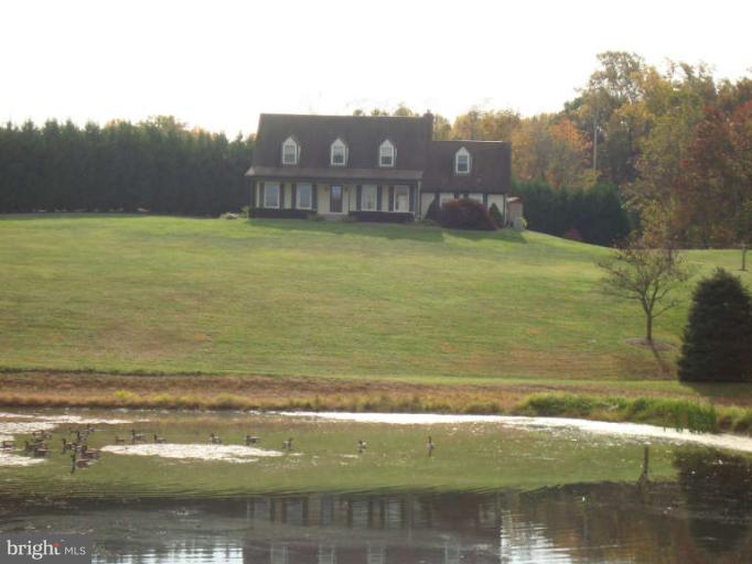 20535 Bucklodge Road Boyds, MD 20841 - Photo 28 of 30 a view of a lake with a building in the background