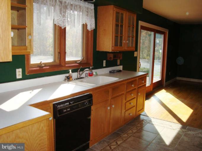 20535 Bucklodge Road Boyds, MD 20841 - Photo 8 of 30 a kitchen with stainless steel appliances granite countertop a sink stove and cabinets