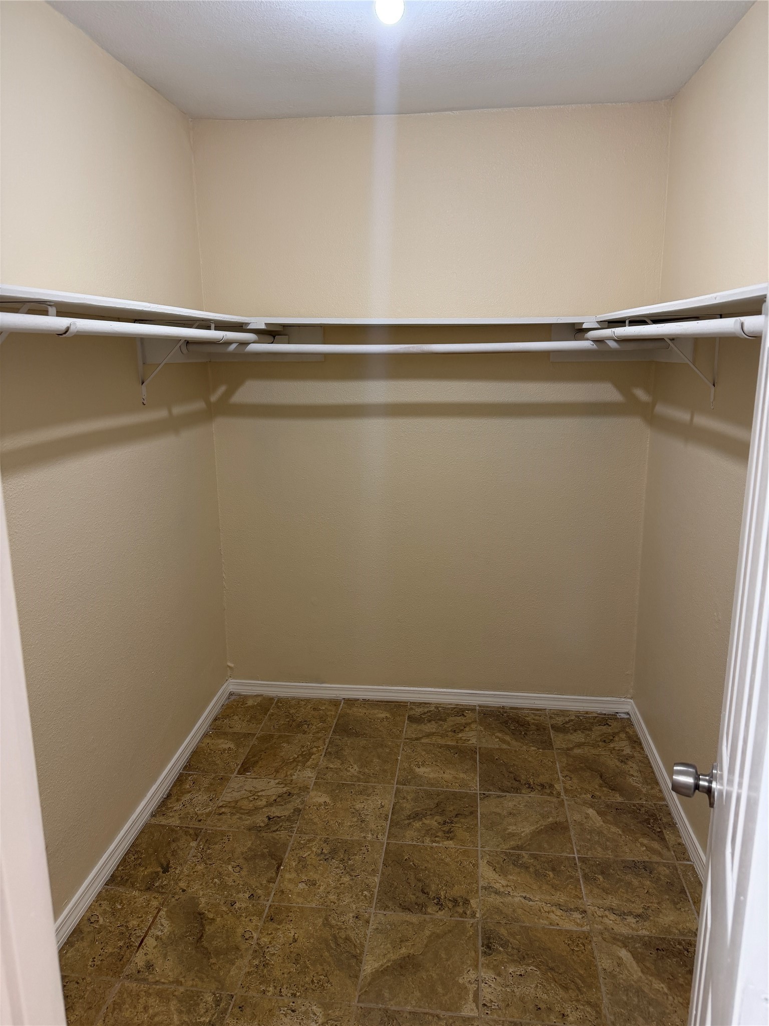 9 Dewthread Court Spring, TX 77380 - Photo 9 of 24 a view of a room with racks on the wall