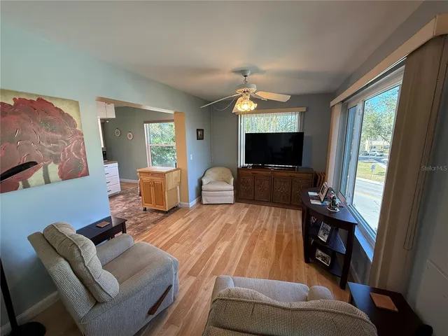 a living room with furniture flat screen tv and a fireplace
