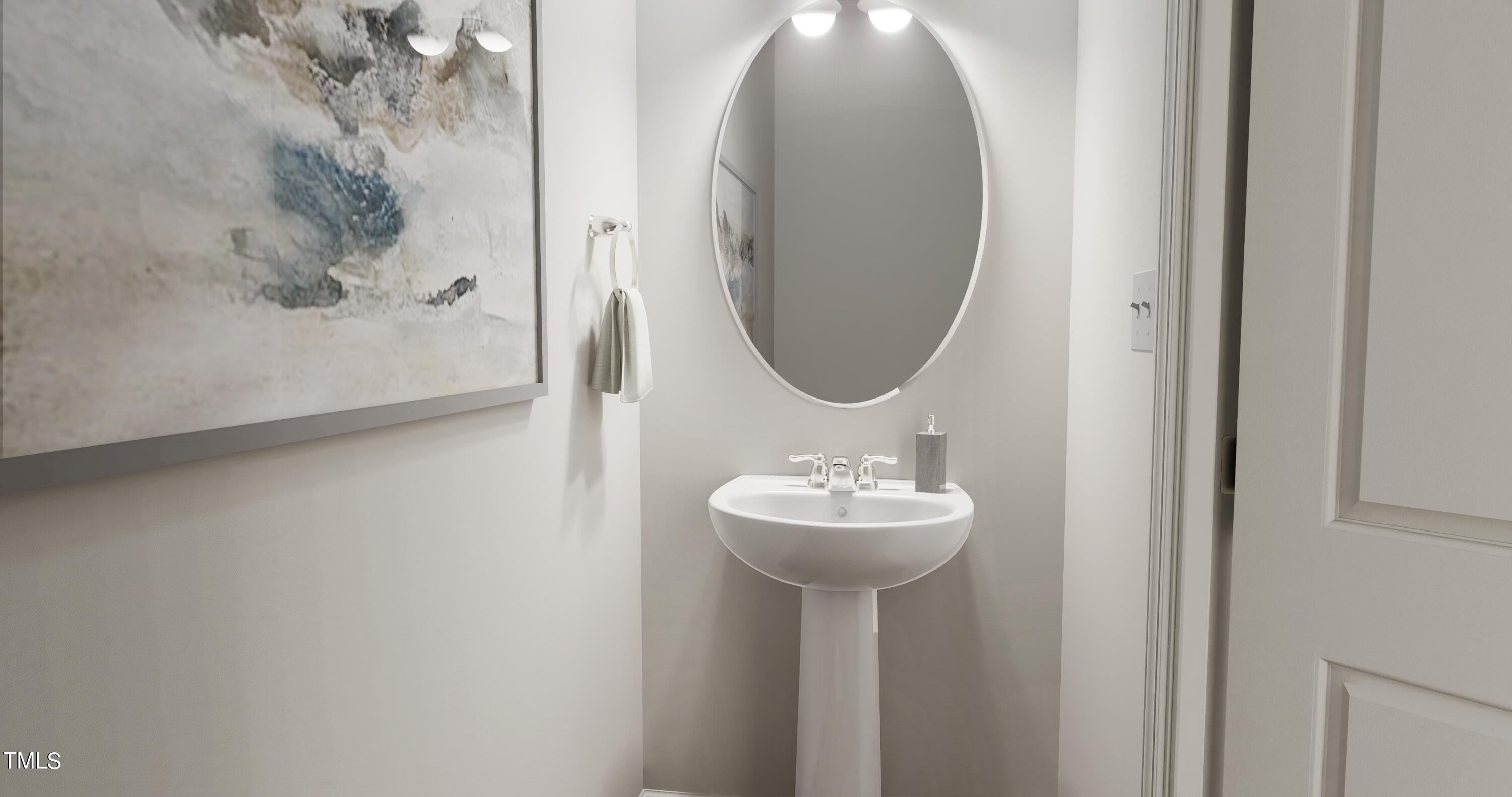 4921 Microcline Trail, Unit 790 Raleigh, NC 27610 - Photo 12 of 46 a bathroom with a sink and a mirror