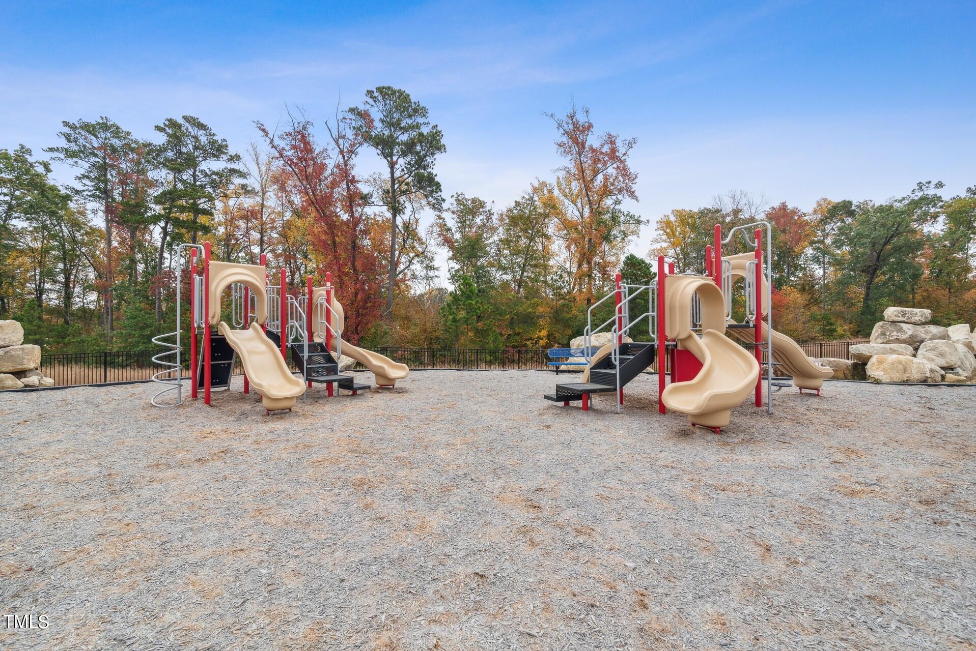 4921 Microcline Trail, Unit 790 Raleigh, NC 27610 - Photo 24 of 46 a view of outdoor space with playground and green space