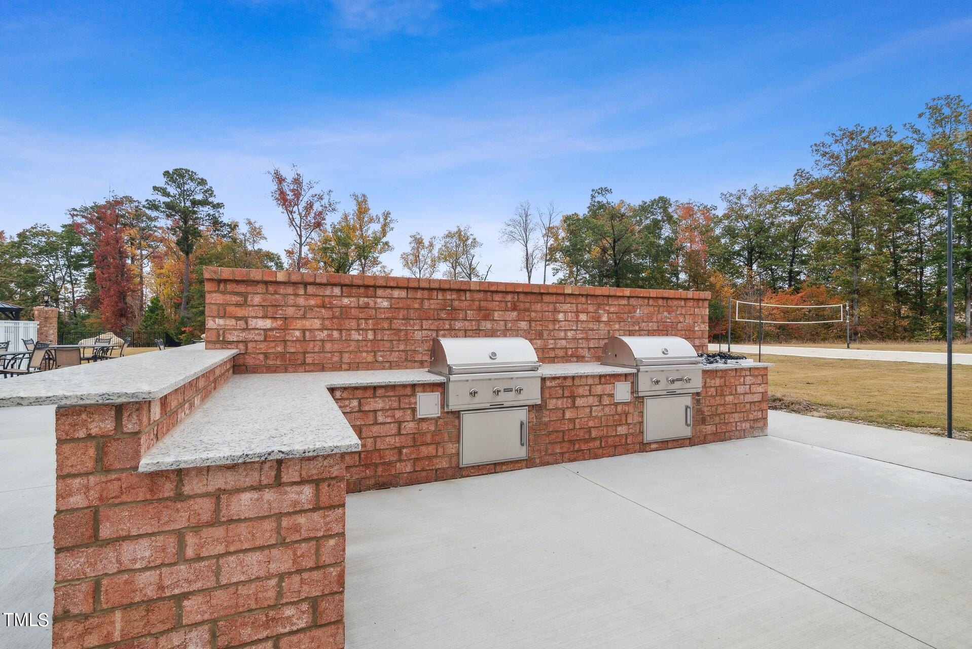 4921 Microcline Trail, Unit 790 Raleigh, NC 27610 - Photo 26 of 46 a view of barbeque grill with seating
