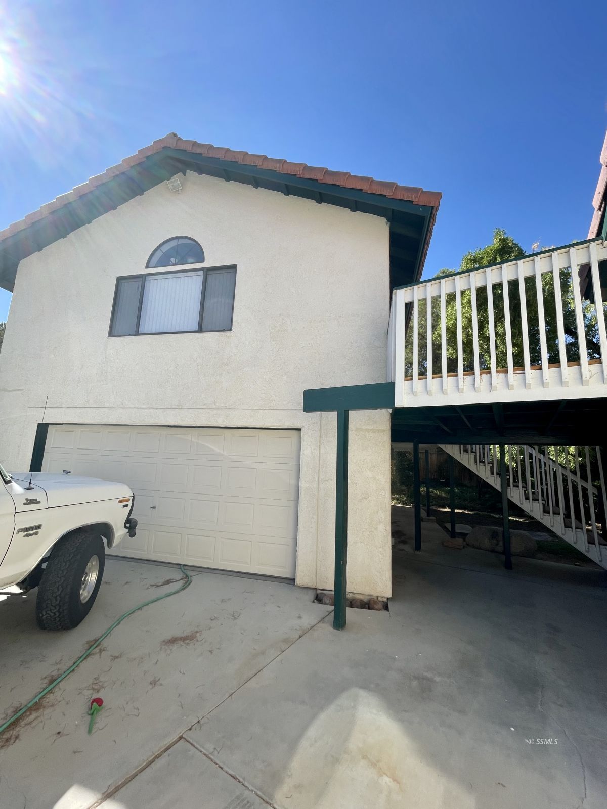 1129 Las Cruces Court Ridgecrest, CA 93555 - Photo 13 of 13 a view of a house with a wooden deck
