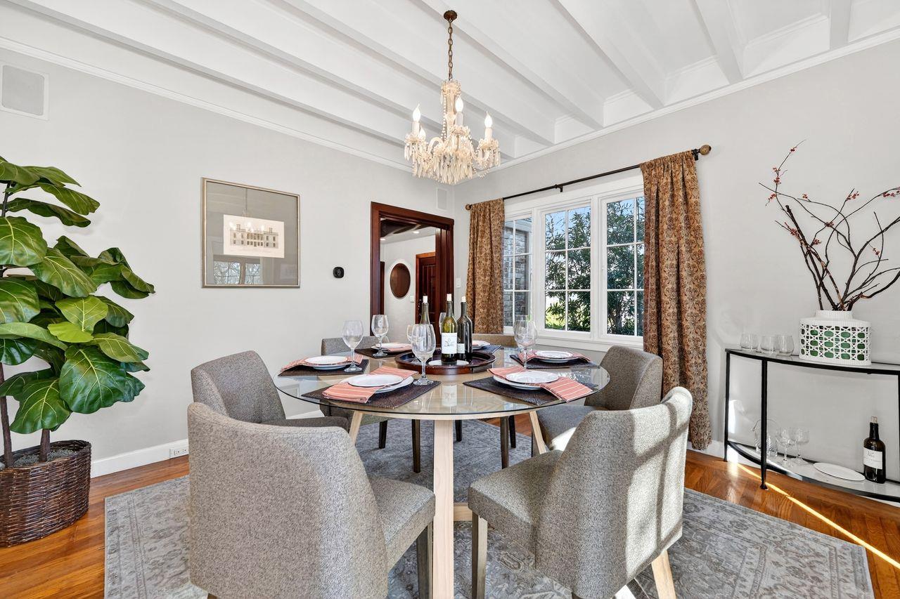 1716 Sutterville Road Sacramento, CA 95822 - Photo 12 of 57 a dining room with furniture a chandelier and window