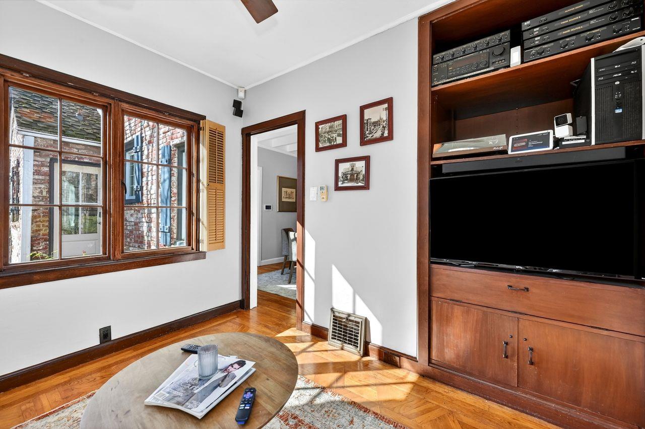 1716 Sutterville Road Sacramento, CA 95822 - Photo 14 of 57 a living room with furniture and a flat screen tv