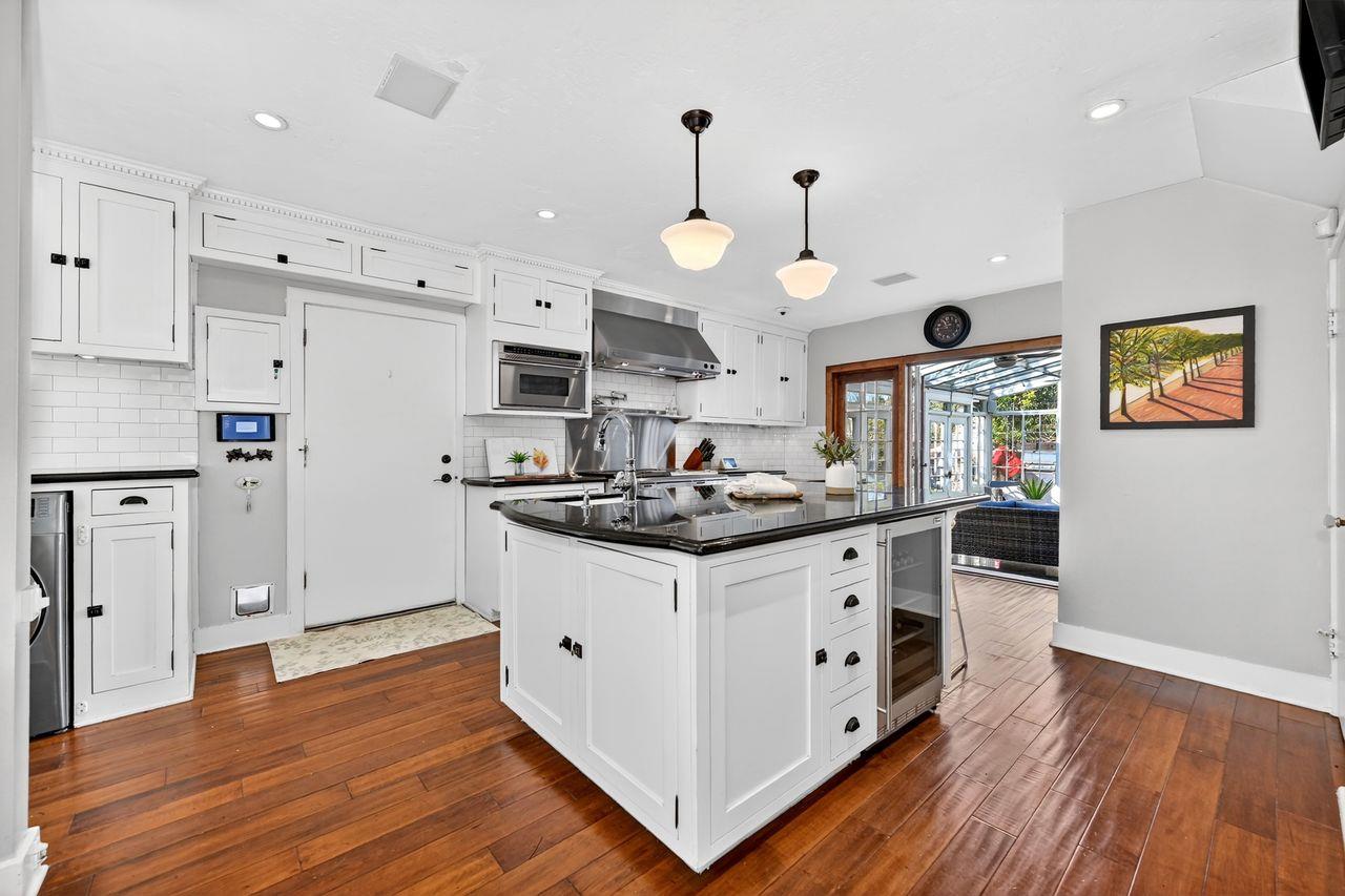 1716 Sutterville Road Sacramento, CA 95822 - Photo 15 of 57 a kitchen with stainless steel appliances granite countertop a stove and a refrigerator