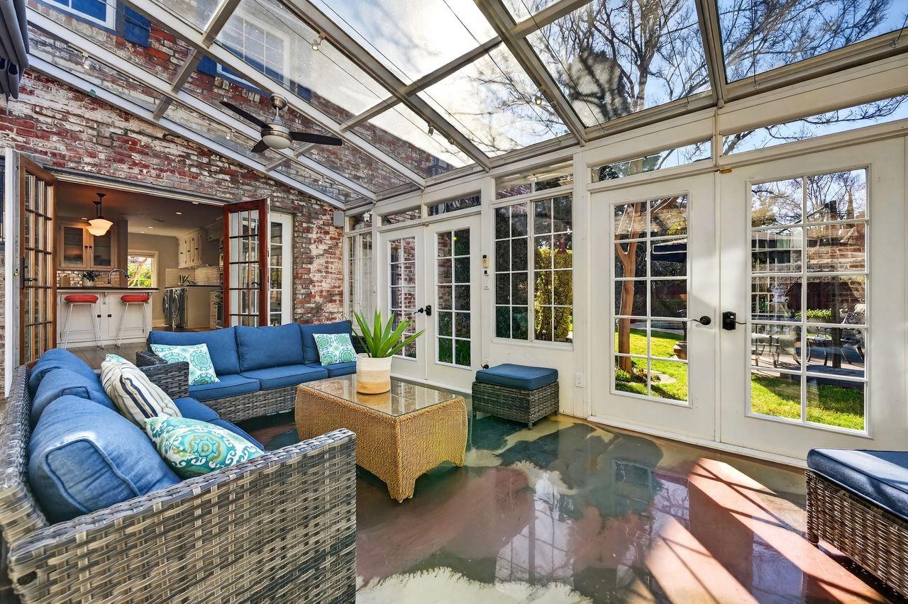 1716 Sutterville Road Sacramento, CA 95822 - Photo 24 of 57 a living room with furniture and floor to ceiling windows