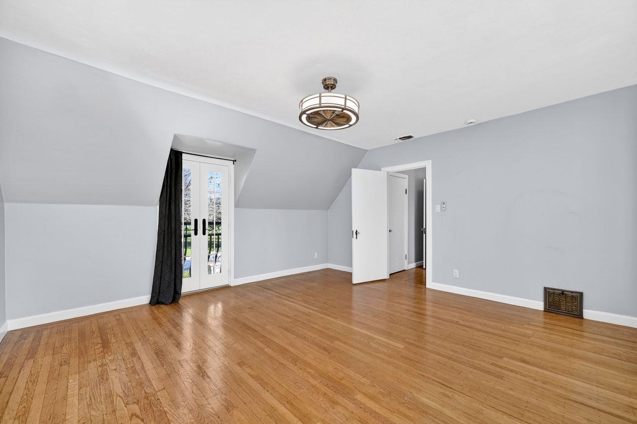 1716 Sutterville Road Sacramento, CA 95822 - Photo 30 of 57 a view of an empty room with wooden floor