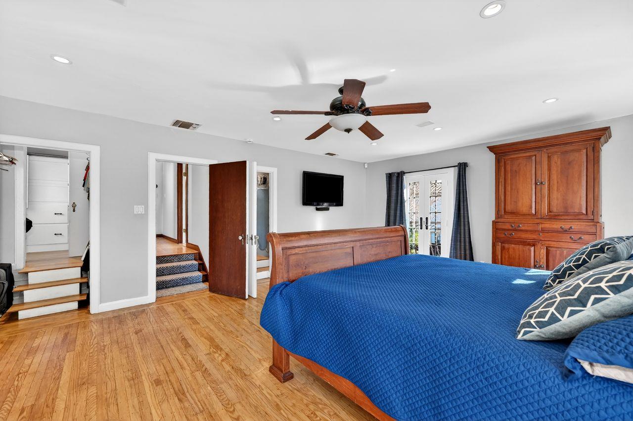 1716 Sutterville Road Sacramento, CA 95822 - Photo 35 of 57 a bedroom with a bed and a flat screen tv