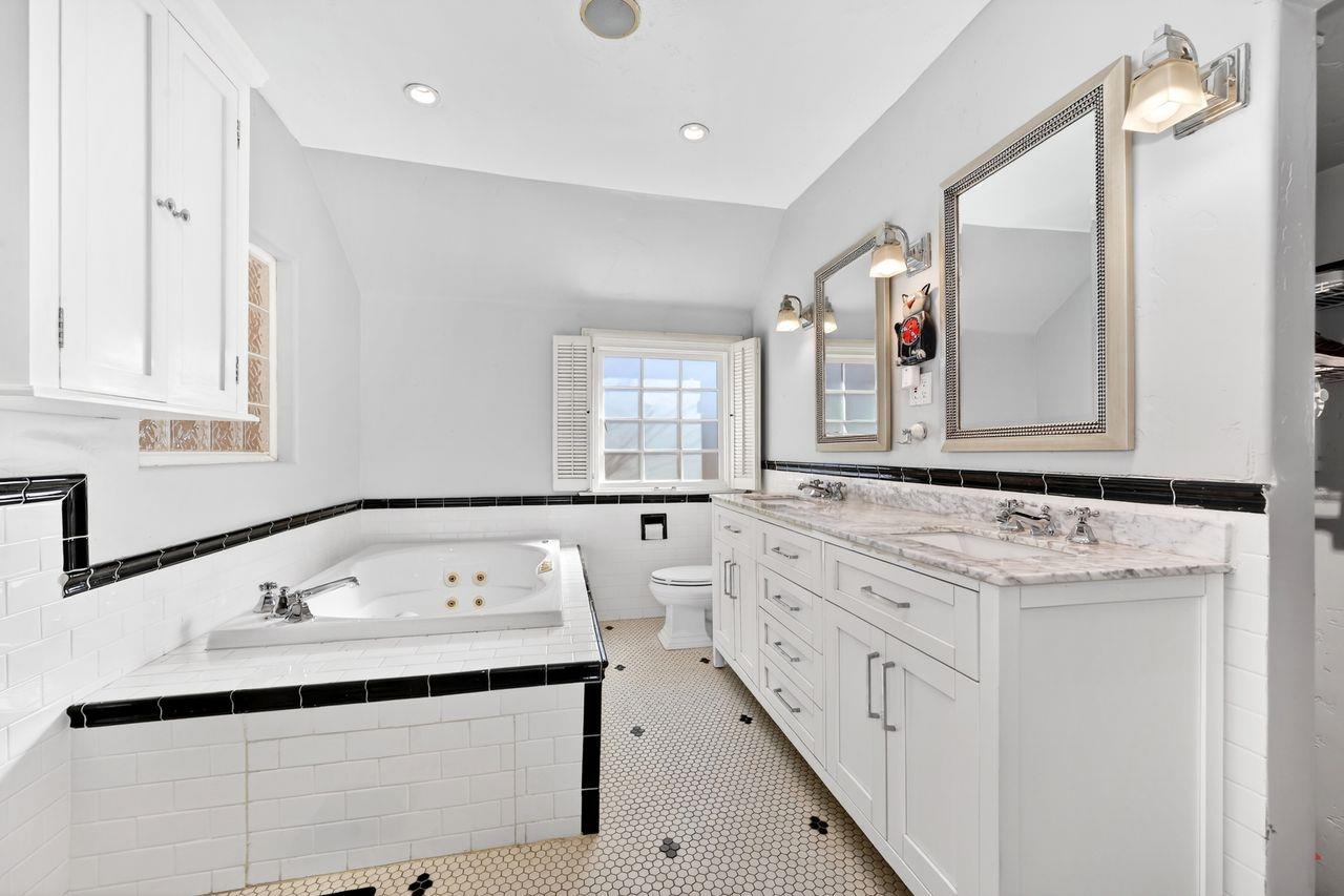 1716 Sutterville Road Sacramento, CA 95822 - Photo 39 of 57 a bathroom with a sink and a mirror