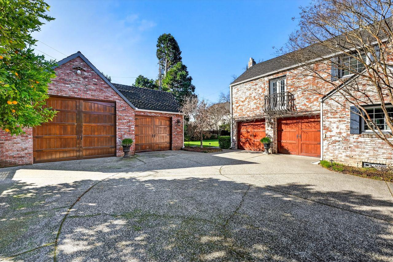 1716 Sutterville Road Sacramento, CA 95822 - Photo 57 of 57 a front view of a house with a yard and a garage