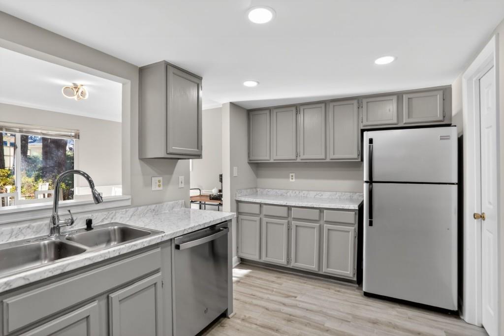 37 Middleton Court Smyrna, GA 30080 - Photo 13 of 25 a kitchen with a sink refrigerator and cabinets