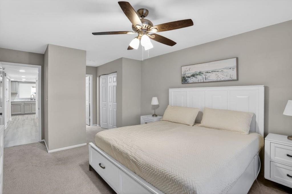 37 Middleton Court Smyrna, GA 30080 - Photo 17 of 25 a bedroom with a large bed and a ceiling fan