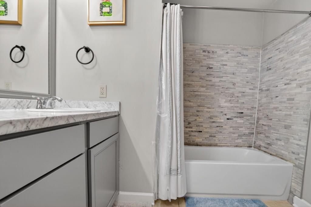 37 Middleton Court Smyrna, GA 30080 - Photo 19 of 25 a bathroom with a tub sink and mirror