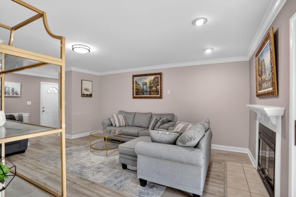 37 Middleton Court Smyrna, GA 30080 - Photo 6 of 25 a living room with furniture and a fireplace