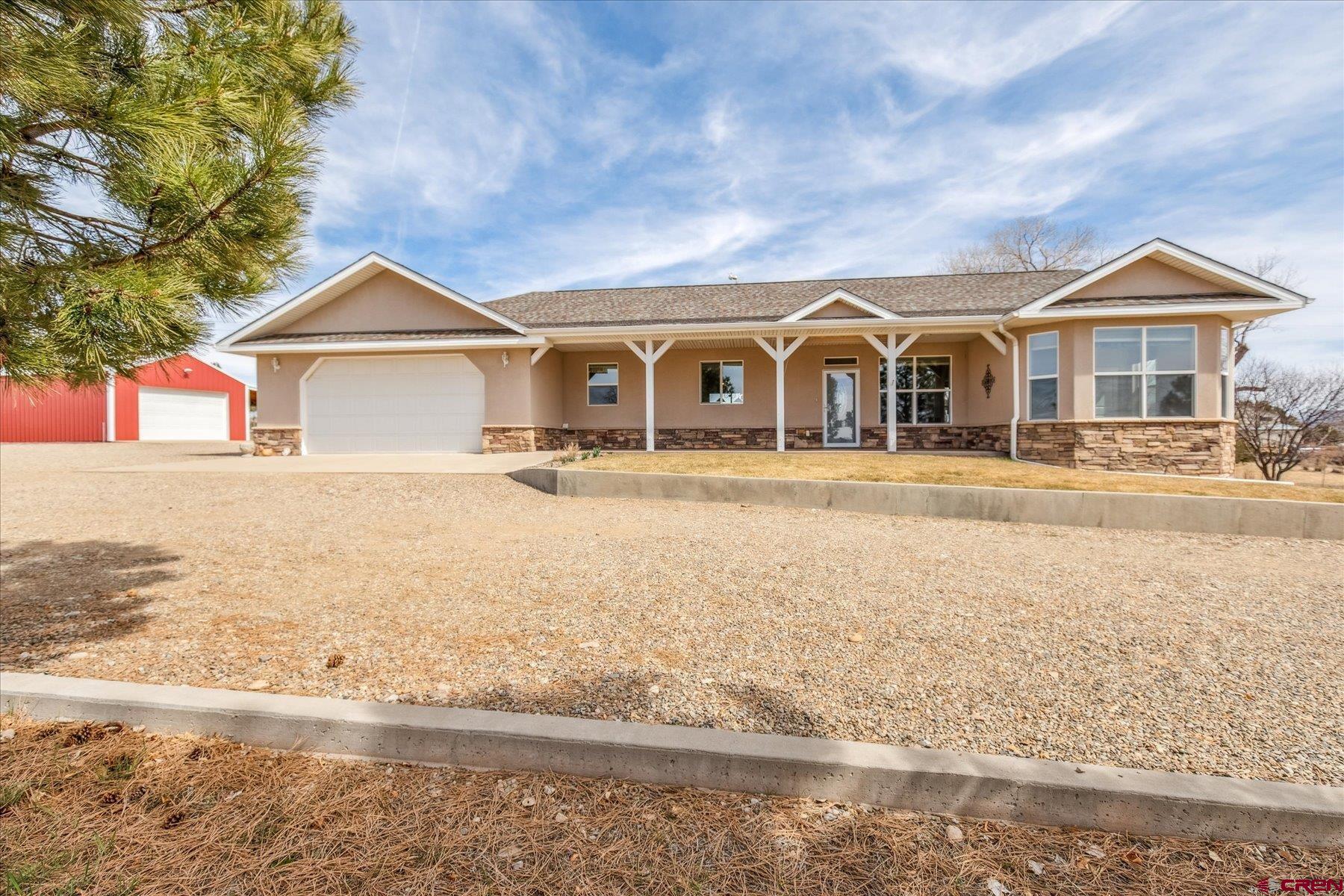 25583 Rd P Dolores, CO 81323 - Photo 1 of 34 a front view of a house with a yard