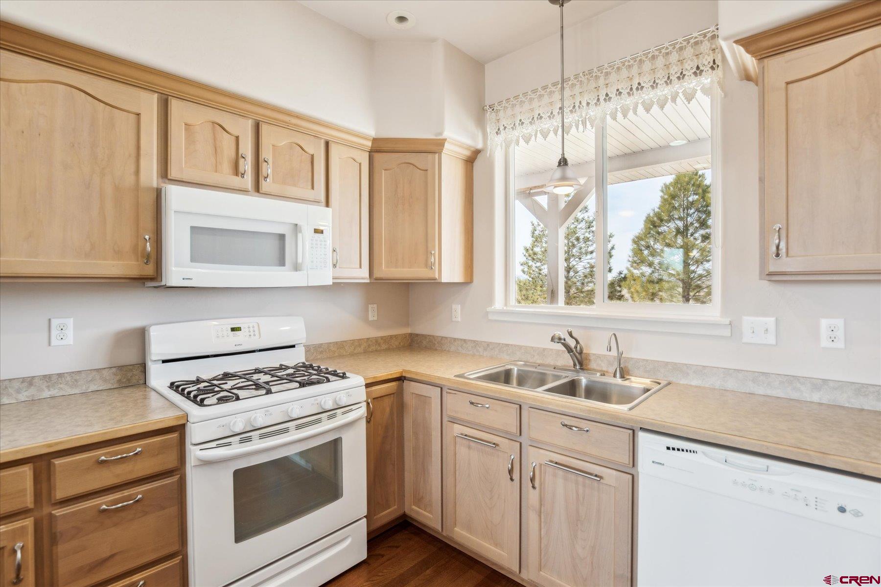 25583 Rd P Dolores, CO 81323 - Photo 11 of 34 a kitchen with appliances cabinets and a sink