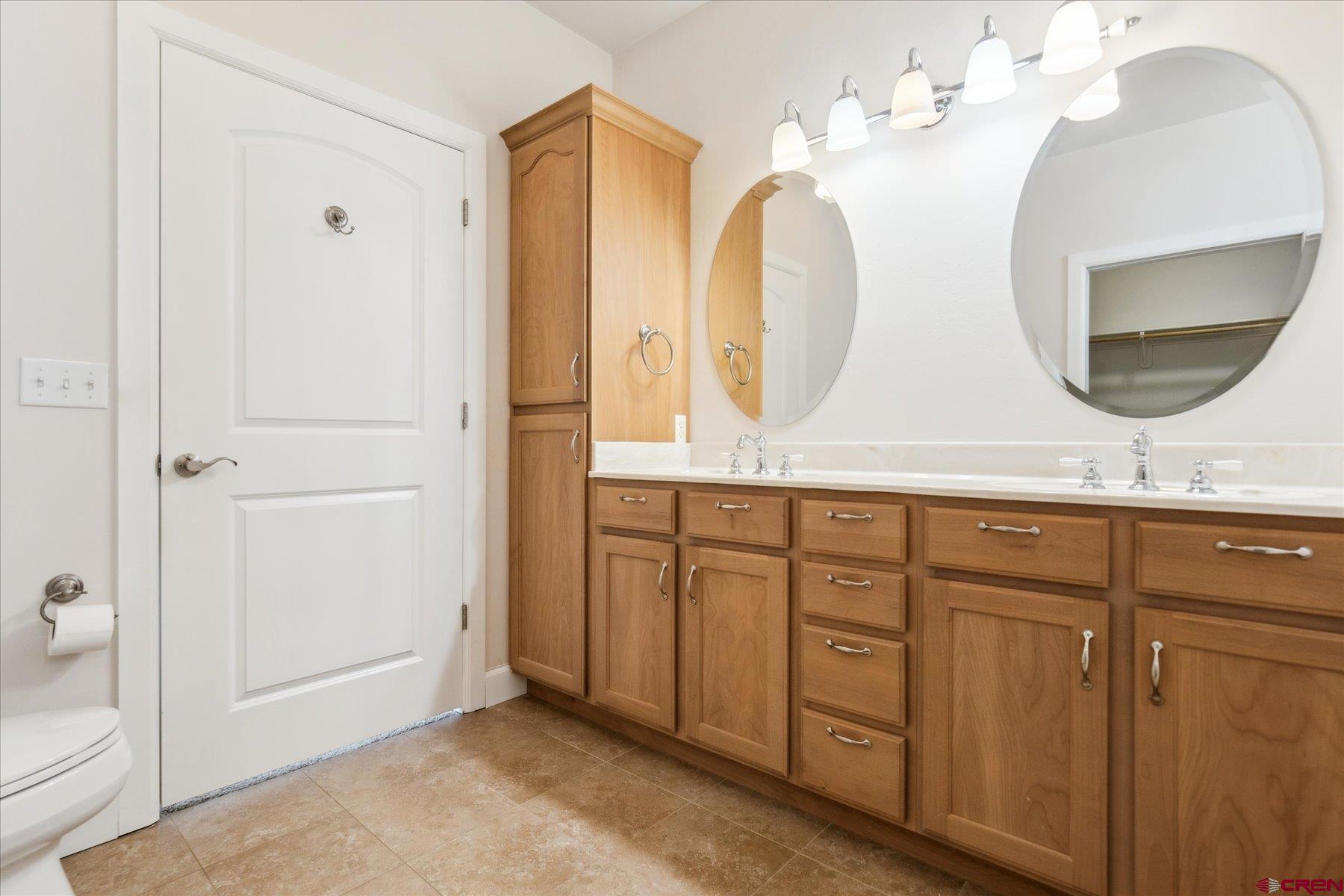 25583 Rd P Dolores, CO 81323 - Photo 17 of 34 a bathroom with a double vanity sink and a mirror