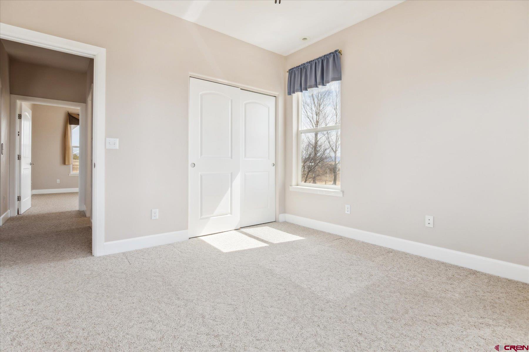 25583 Rd P Dolores, CO 81323 - Photo 20 of 34 an empty room with windows and closet