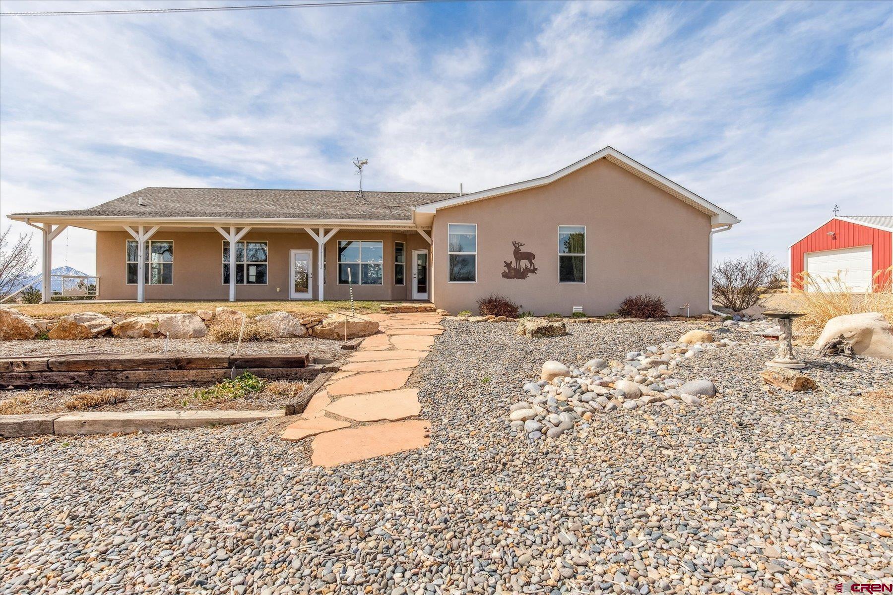 25583 Rd P Dolores, CO 81323 - Photo 24 of 34 a front view of a house with a yard