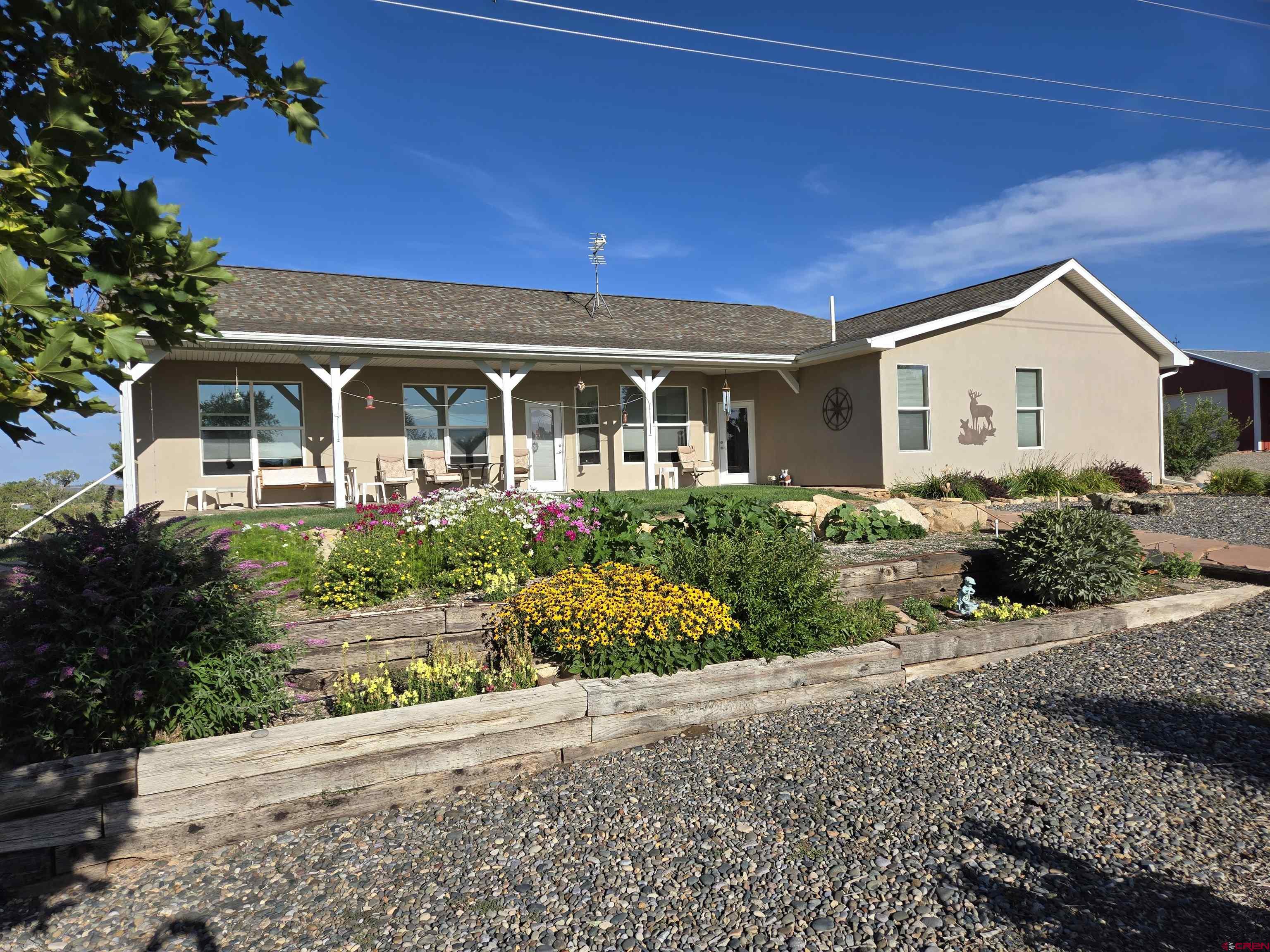 25583 Rd P Dolores, CO 81323 - Photo 32 of 34 front view of a house with a yard