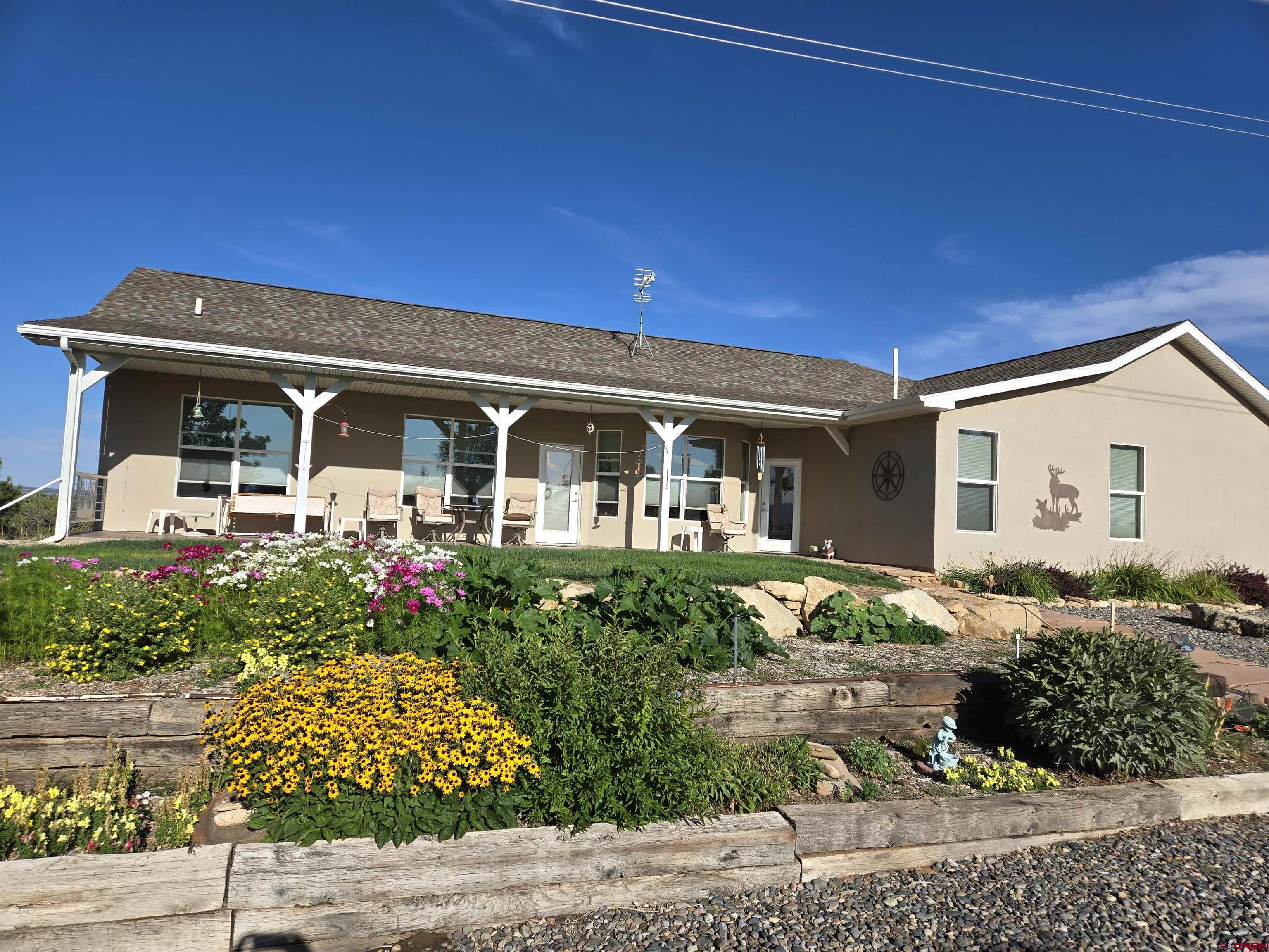 25583 Rd P Dolores, CO 81323 - Photo 33 of 34 front view of a house with a porch