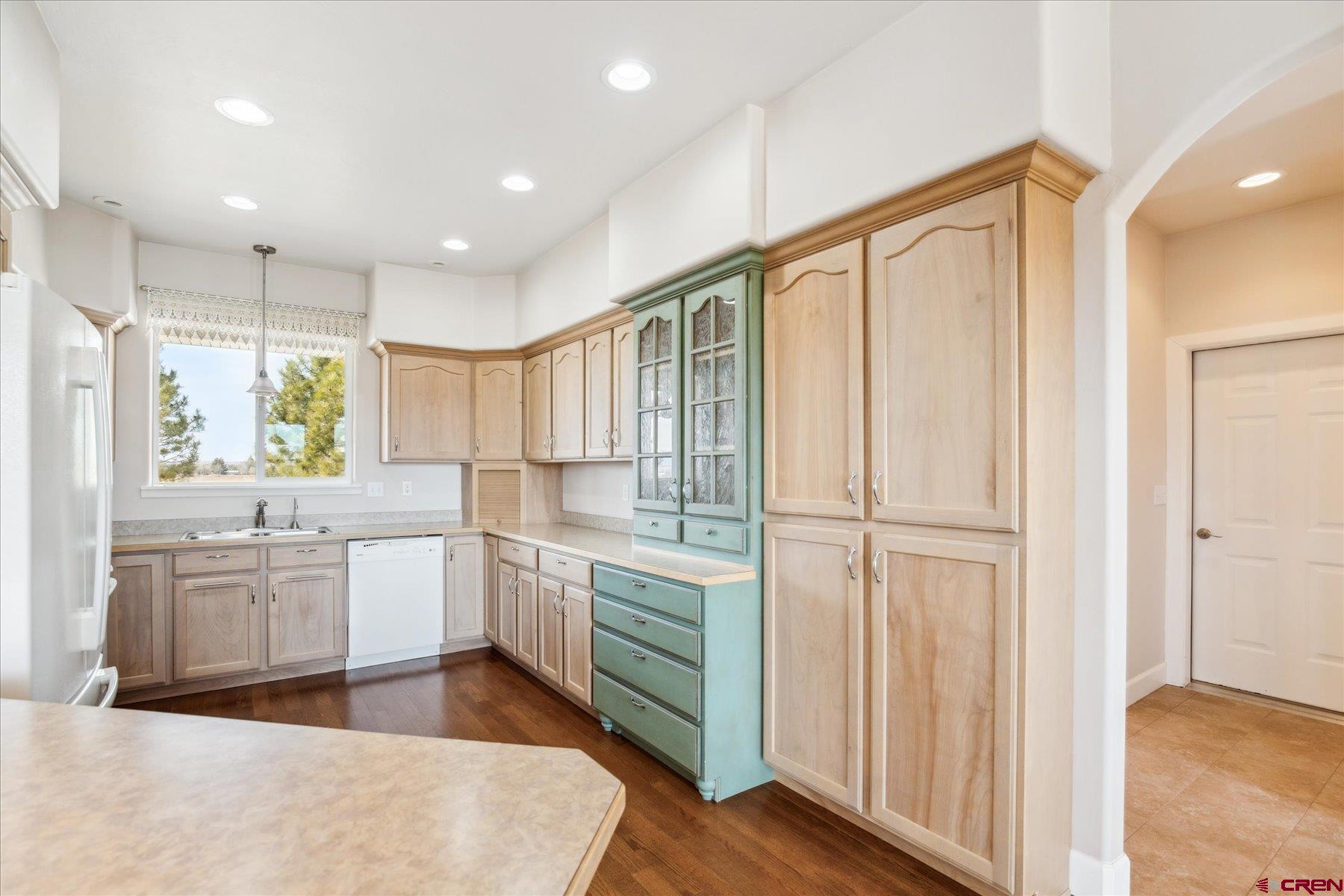 25583 Rd P Dolores, CO 81323 - Photo 10 of 34 a large white kitchen with a large window
