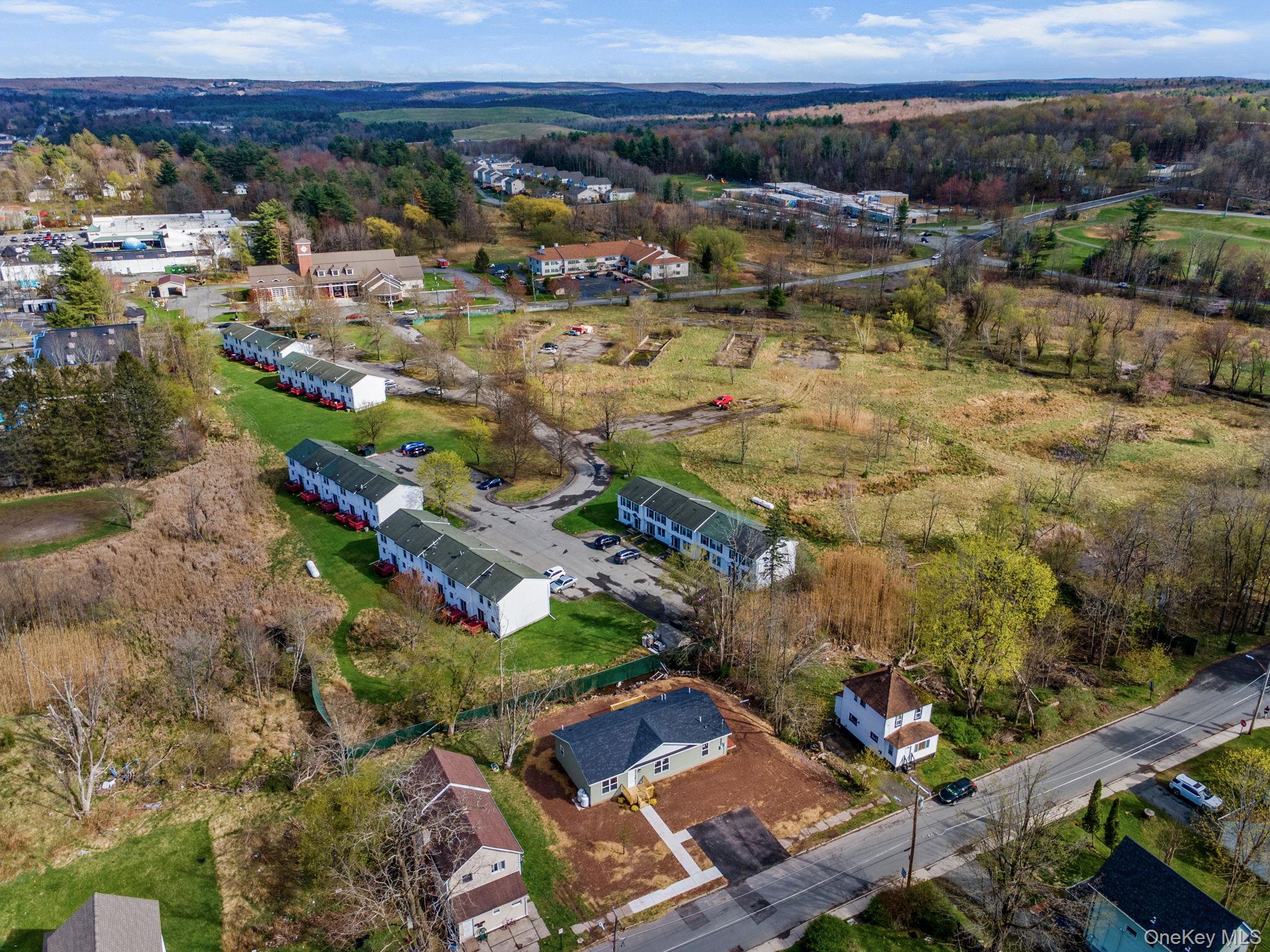 23 Spring Street Monticello, NY 12701 - Photo 37 of 44 an aerial view of residential houses with outdoor space