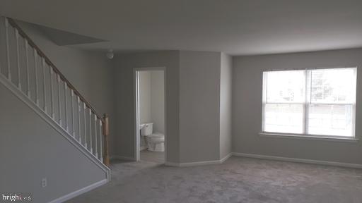 4 Bridle Path Wilmington, DE 19808 - Photo 13 of 14 a view of an empty room with wooden floor and a window