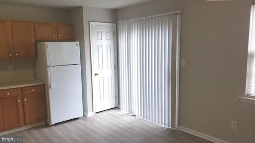 4 Bridle Path Wilmington, DE 19808 - Photo 7 of 14 a view of a kitchen with a refrigerator and cabinet