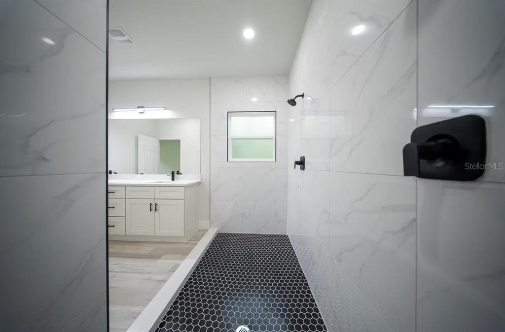 6442 North Sandborn Loop Citrus Springs, FL 34433 - Photo 17 of 33 a bathroom with a sink and a mirror