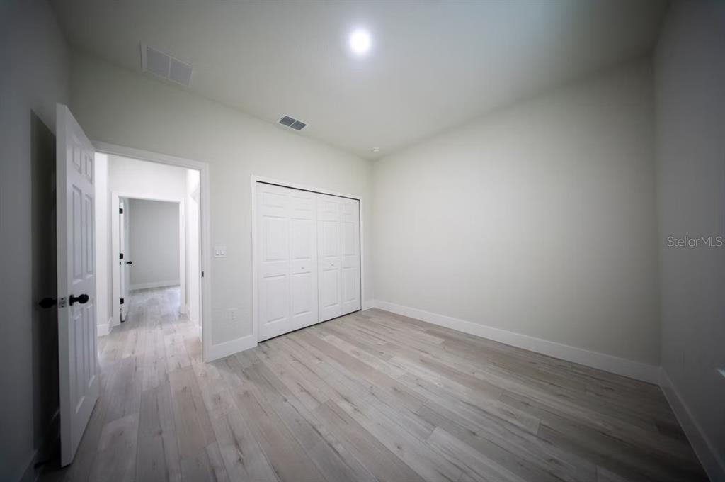 6442 North Sandborn Loop Citrus Springs, FL 34433 - Photo 27 of 33 wooden floor in an empty room