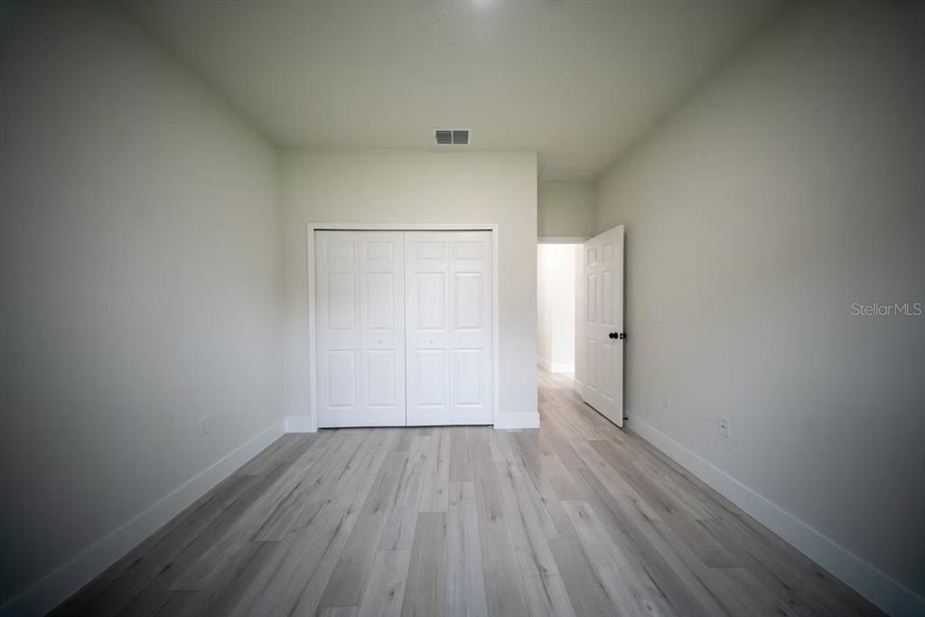 6442 North Sandborn Loop Citrus Springs, FL 34433 - Photo 29 of 33 a view of an empty room and wooden floor