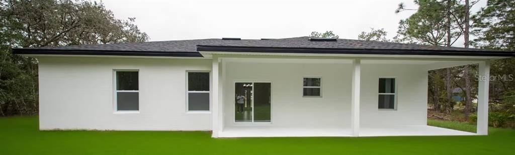 6442 North Sandborn Loop Citrus Springs, FL 34433 - Photo 32 of 33 a view of wooden house with a small yard