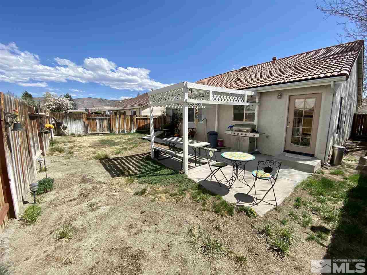 1645 Westmont Lane Reno, NV 89521 - Photo 16 of 16 a view of a house with backyard and sitting area