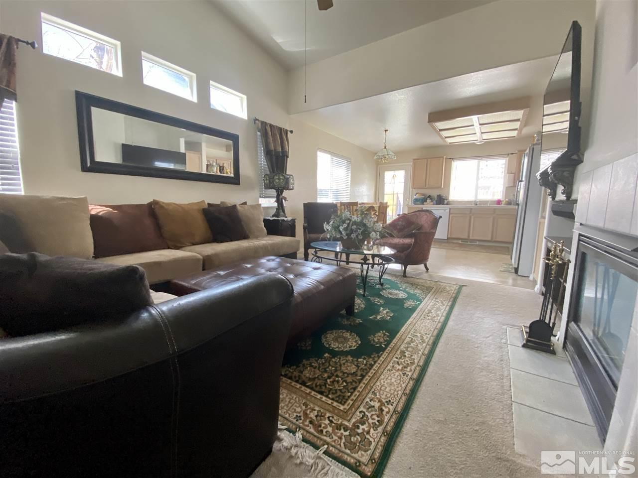 1645 Westmont Lane Reno, NV 89521 - Photo 3 of 16 a living room with furniture and a fireplace