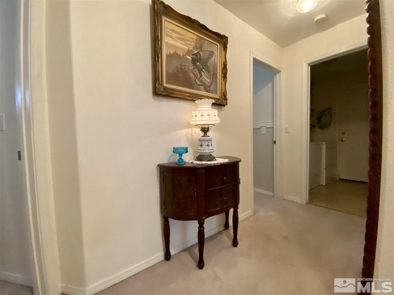 1645 Westmont Lane Reno, NV 89521 - Photo 7 of 16 a room with furniture and a mirror