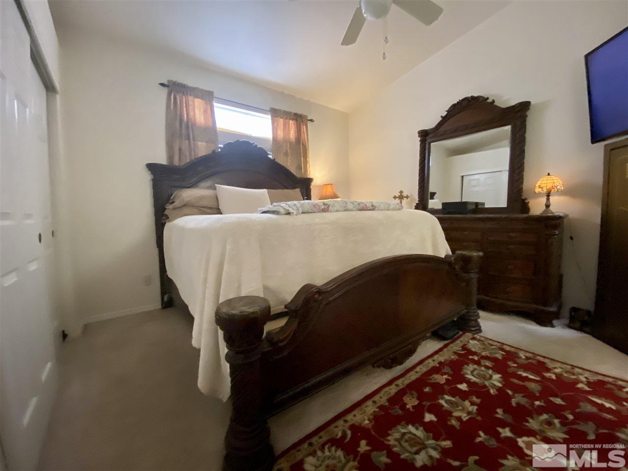1645 Westmont Lane Reno, NV 89521 - Photo 10 of 16 a bedroom with a bed and window