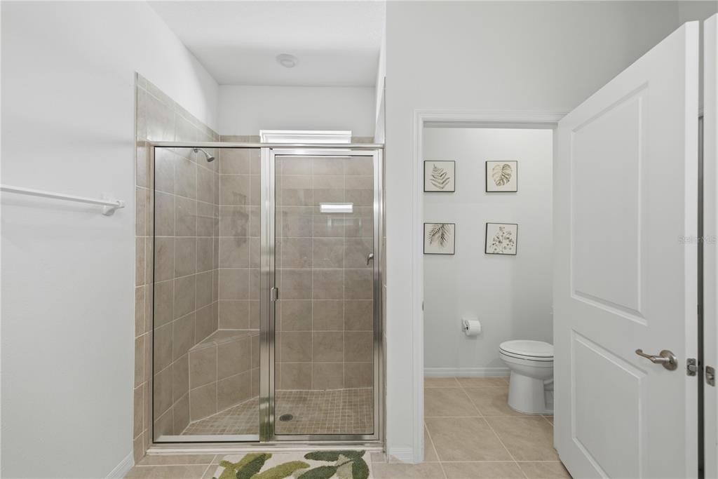 5157 Northwest 43rd Ln Road Ocala, FL 34482 - Photo 12 of 70 a bathroom with a shower and a toilet