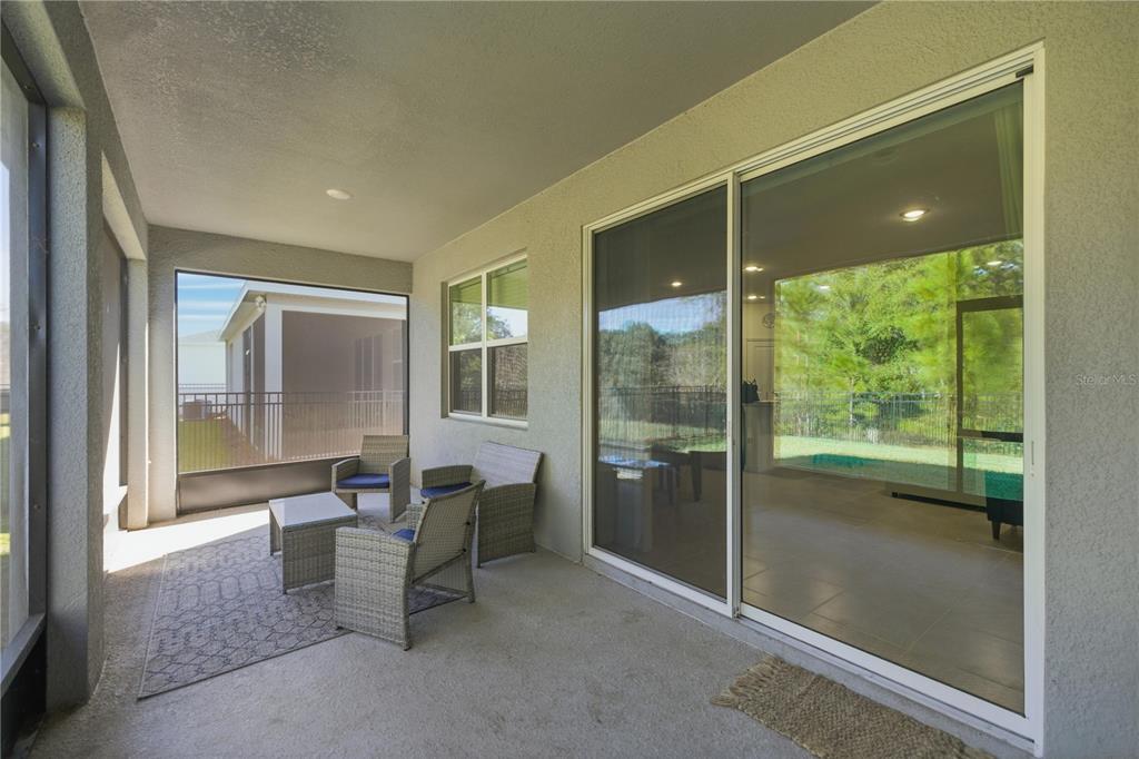5157 Northwest 43rd Ln Road Ocala, FL 34482 - Photo 21 of 70 a dining room with furniture and a floor to ceiling window