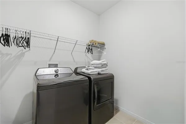 a view of a house with backyard and porch