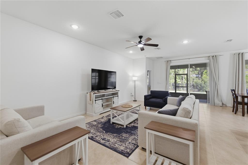 5157 Northwest 43rd Ln Road Ocala, FL 34482 - Photo 3 of 70 a living room with furniture and a flat screen tv